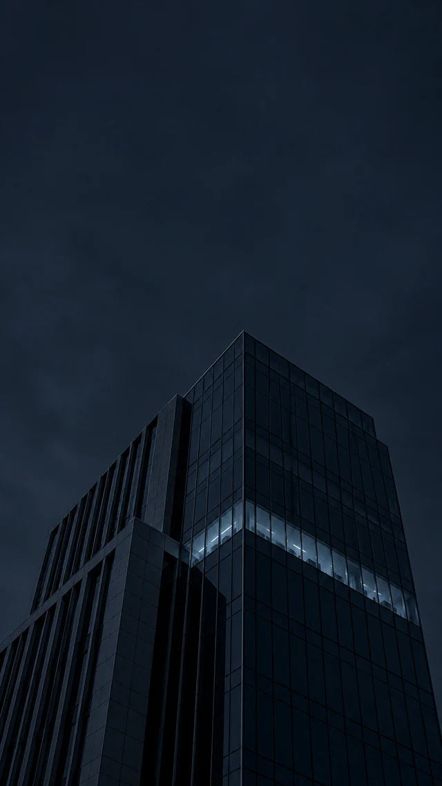 An office building at night with one floor lit
